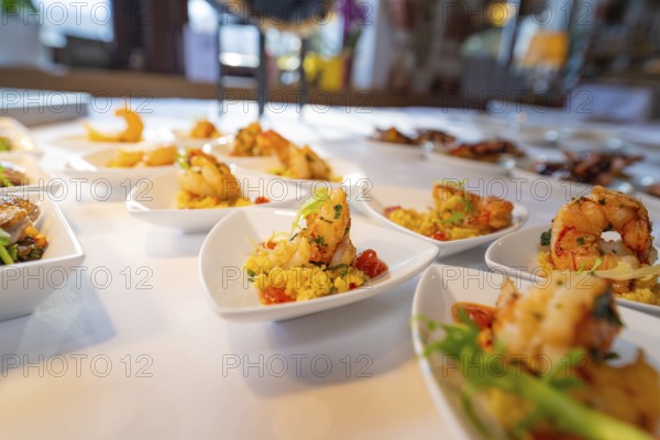 Elegant presentation of prawns on small plates with decorative garnishes, Europäischer Hof,