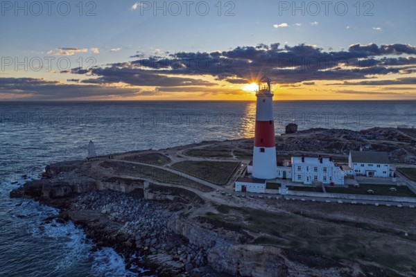 Sunset over Portland Bill Lighthouse from a drone, Portland Bill, Isle of Portland, Dorset,