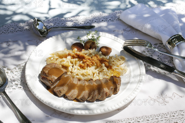 Swabian cuisine, roast venison with spaetzle, chestnuts and breadcrumbs, breadcrumbs, saddle of