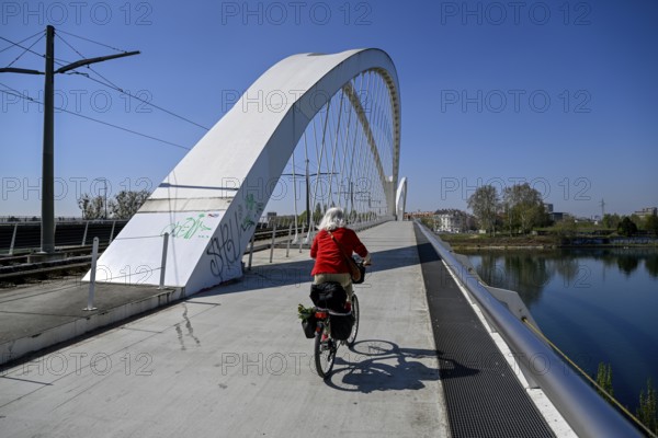 Cyclist on the Beatus-Rhenanus-Bridge, tram bridge over the Rhine, Kehl, Ortenaukreis,