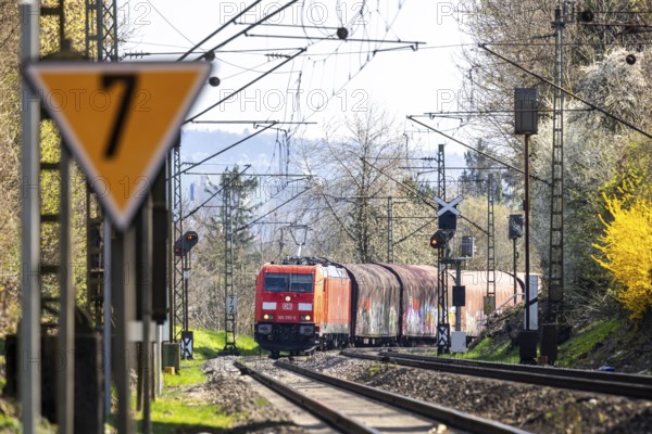 Goods train with a Deutsche Bahn AG locomotive travelling on the open track. Stuttgart,
