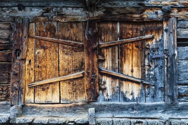 Weathered loading door of an old hay barn, Grimentz, Val d'Anniviers, Valais Alps, Canton Valais,