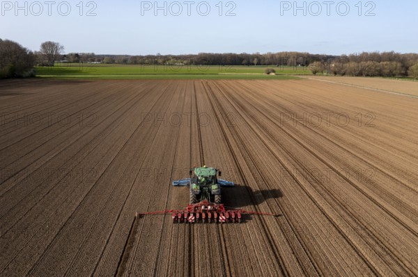Sugar beet being sown in spring, precision sowing with precision seed drill, behind a tractor,