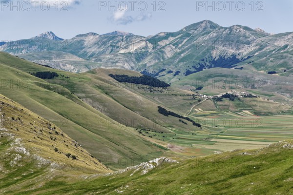 Mountain landscape on the edge of the Pian Grande di Castelluccio di Norcia plateau in the Monti