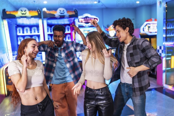 Four multi ethnic friends singing karaoke and dancing, enjoying their weekend together in a vibrant