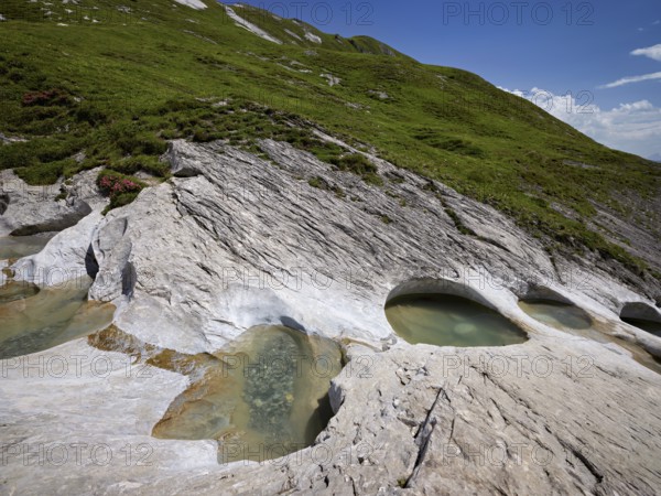 Glacier mill with glacier pots on the Trinser Alp Mora, Trin, Canton Graubünden, Switzerland,