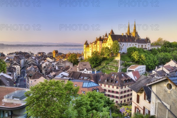 Neuchâtel Castle with view over the town of Neuchâtel at sunrise, behind it Lake Neuchâtel, Canton