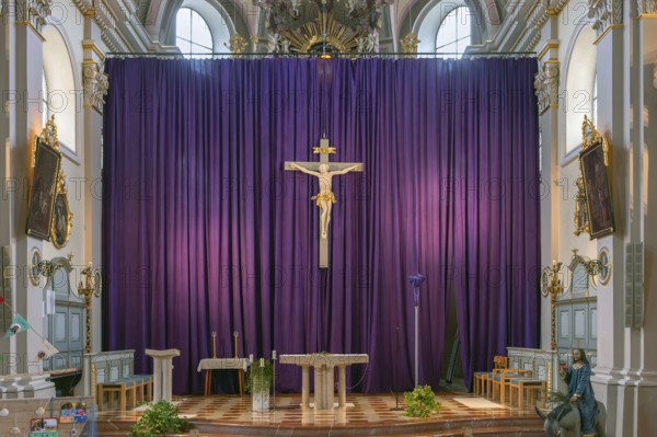 Large purple Lenten cloth in front of the high altar in the baroque parish church of St Nicholas,