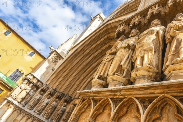 Ancient statues decorating the entrance of tarragona cathedral in spain, showcasing architectural