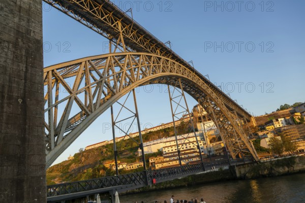 Golden hour at Dom Luis I Bridge crossing River Douro to Vila Nova de Gaia, Porto, Portugal, Europe