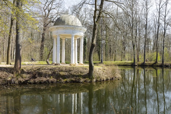 Diana Temple in Lützschena Castle Park with reflection in the water, Leipzig, Saxony, Germany,