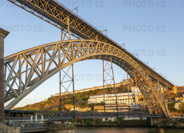 Golden hour at Dom Luis I Bridge crossing River Douro to Vila Nova de Gaia, Porto, Portugal, Europe