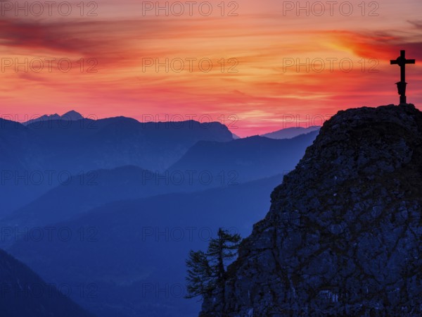 Cross on the summit of the Kleiner Jenner at dusk, Reiteralpe in the background, Berchtesgaden