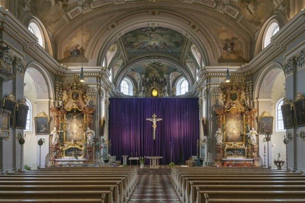 Interior with large purple Lenten cloth in front of the high altar, baroque parish church of St