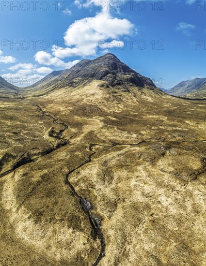 Panorama of Buachaille Etive Beag and Three Sisters in Glencoe over Moors and Road A82 from a