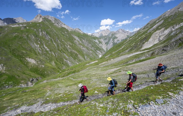Group of mountaineers on a hiking trail, view of the Dabertal valley, Lasörling Höhenweg, Lasörling