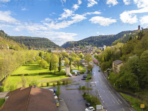 View of town with neighbouring forest and hills under blue sky, Bad Liebenzell, district Calw,