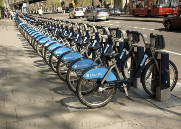 Racks of bikes available for rental under Barclays bicycle hire scheme, London