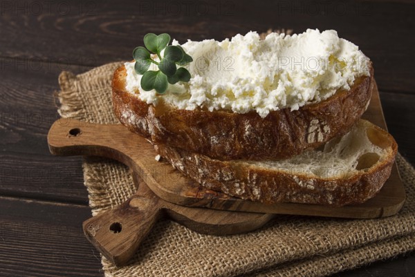 Sandwich, with cream cheese, homemade, on a cutting board, rustic style, no people, selective