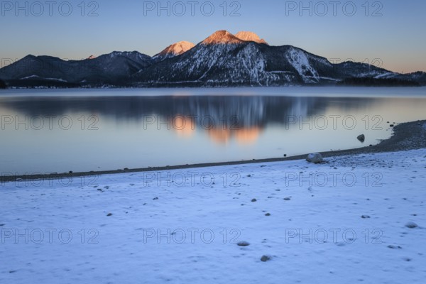 Sunrise over mountain lake, reflection, winter, Walchensee, view of Herzogstand and Heimgarten,