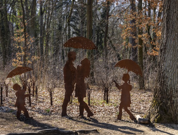 Rusty figures with umbrella, art installation on the grounds of the former tuberculosis sanatorium