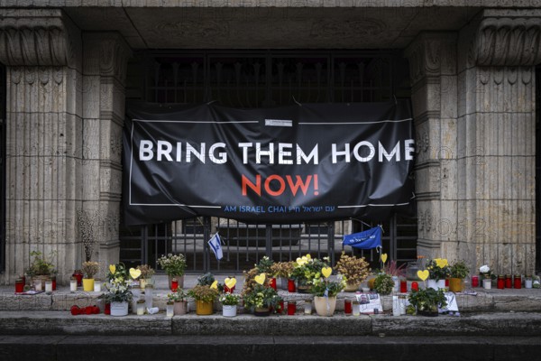 A BRING THEM HOME NOW! banner hangs in front of the Orthodox Synagogue in Frankfurt's Westend. It