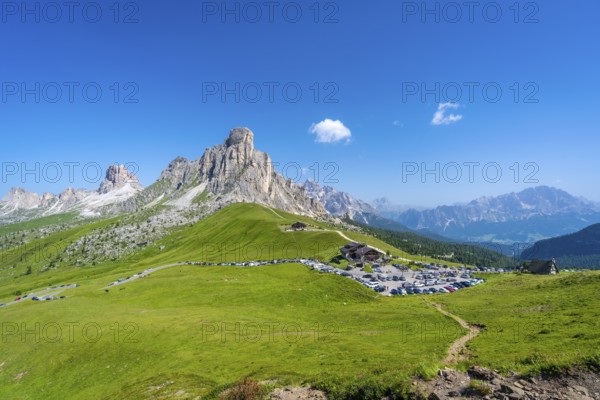Panoramic view of the parking area at passo giau in the dolomites on a sunny summer day,