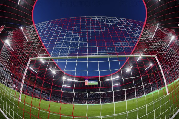 Overview, interior, floodlit match, behind-the-goal perspective, goal net, blue hour, fisheye shot,
