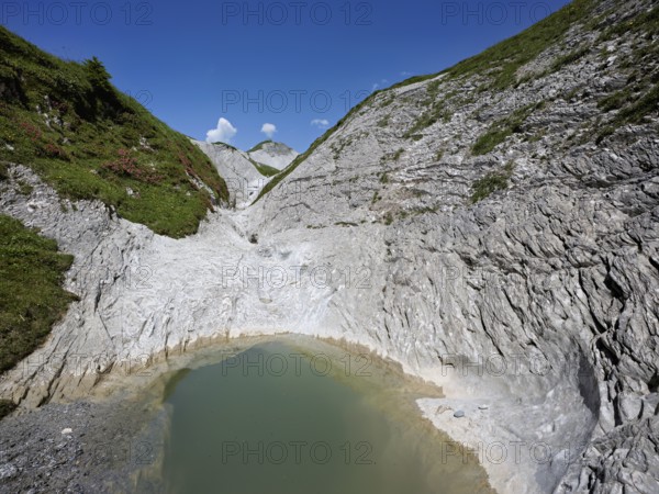 Glacier mill with glacier pots on the Trinser Alp Mora, Trin, Canton Graubünden, Switzerland,