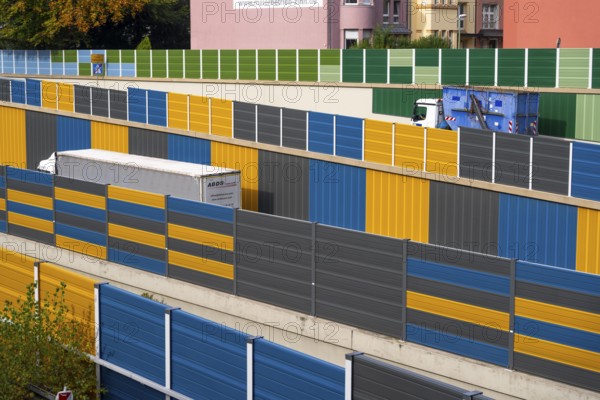 Colourful noise barriers on the A52 motorway, at the Essen-Rüttenscheid junction, the noise