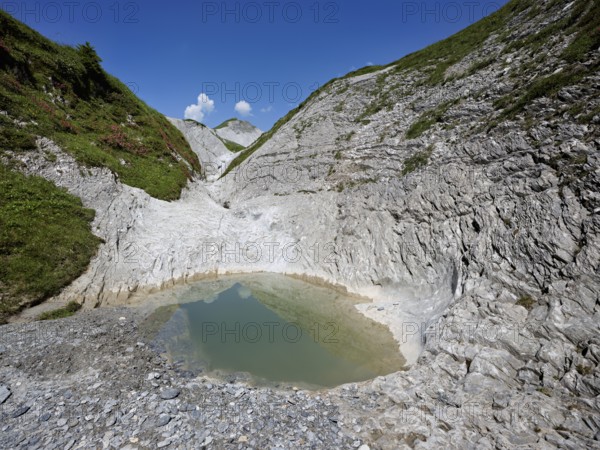 Glacier mill with glacier pots on the Trinser Alp Mora, Trin, Canton Graubünden, Switzerland,