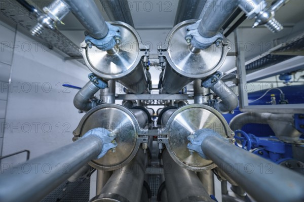 View of an industrial pipe system with many metal elements and blue coatings, ENCW Netze Calw