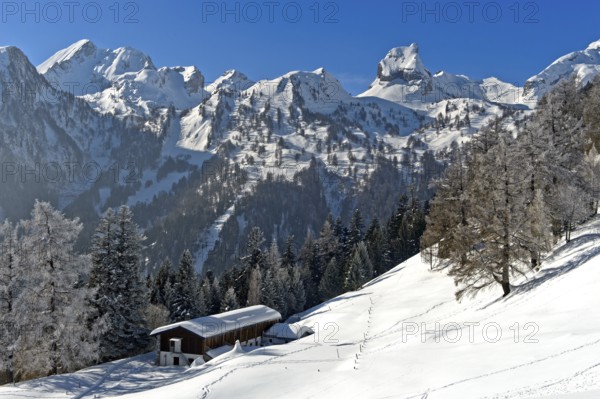 Winter view over the Loutse children's holiday home to the snow-covered Alpine peaks with Grand
