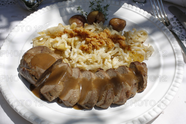 Swabian cuisine, roast venison with spaetzle, chestnuts and breadcrumbs, breadcrumbs, saddle of