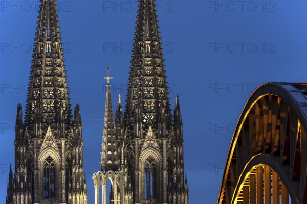 Cologne Cathedral and the Hohenzollern Bridge illuminated with LED lights, Cologne, North