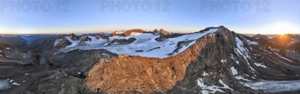 DefaultAtmospheric sunrise in a picturesque mountain landscape, alpenglow, aerial view, mountain