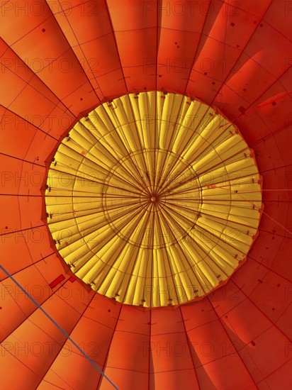Hot air balloon inside view, top opens to release warm air before landing. Hot air balloon ride