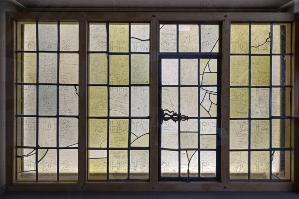Interior photograph, visitors' signatures carved into window glass, William Shakespeare's