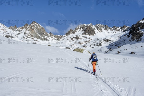 Ski tourers on the Bündner Haute Route, Albula Alps in winter, Rhaetian Alps, Graubünden, Eastern