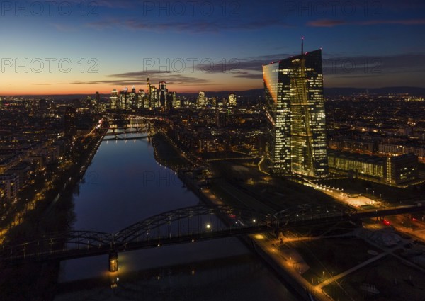 The lights in the offices of the European Central Bank (ECB) and in the skyscrapers of Frankfurt's