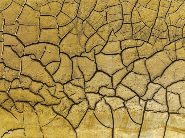 Mineral-rich cracked earth at the bank of the Rio Tinto (Red river), aerial view, drone shot,