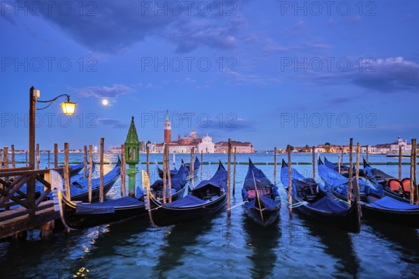 Romantic vacation Venice travel background, gondolas at Saint Mark (San Marco) square and Basilica