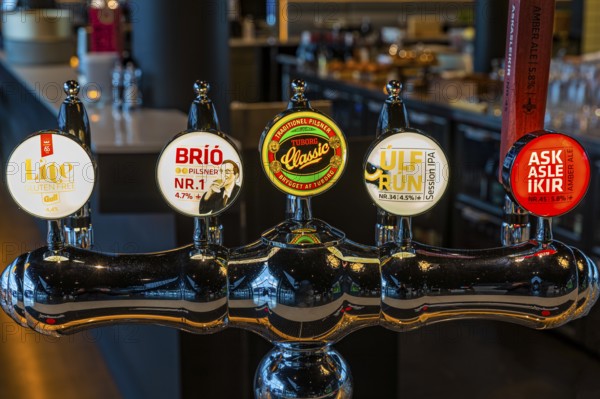 Illuminated beer tap at Hnoss Restaurant and Bar, Harpa Concert Hall and Congress Centre,