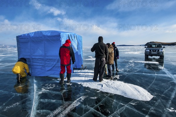 Group of scuba divers before a dive under ice, Lake Baikal, Olkhon Island, Pribaikalsky National