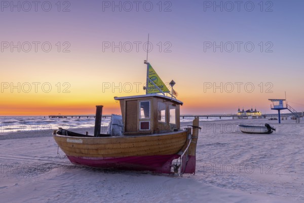 Traditional wooden fishing boat on the beach along the Baltic Sea at Ahlbeck, Heringsdorf on the
