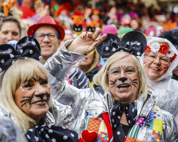 Colourfully costumed carnivalists celebrate carnival in Cologne, on Weiberfastnacht the street