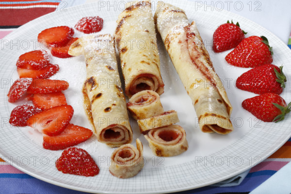 Swabian cuisine, filled pancakes, Flädle with strawberry jam and icing sugar, Gsälz, fresh