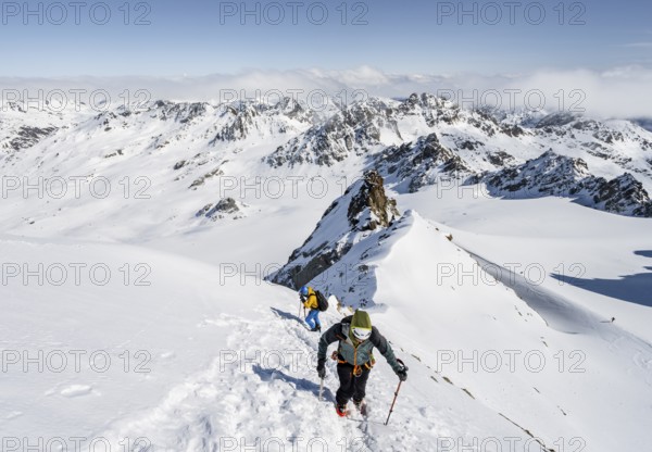 For mountaineers with ice axe and crampons, ascent through steep snowfield to Piz Kesch or Piz