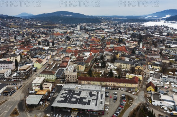 Drone shot, townscape with residential buildings and shopping centres, town view, Feldkirchen in