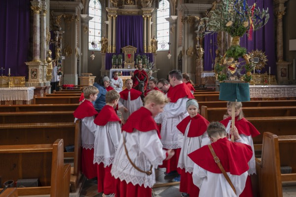 Altar servers preparing for the palm tree procession, tradition since the 18th century, Parish